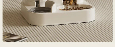 Pet food bowl with dry kibble on a textured surface