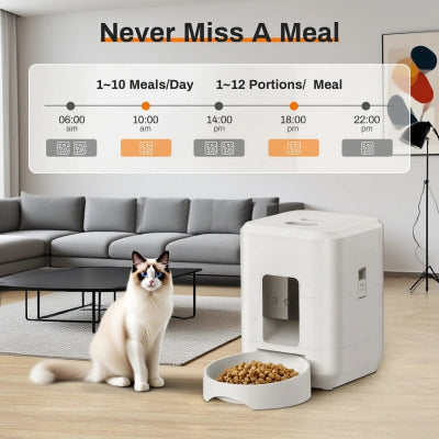 Cat sitting next to a white pet feeder with a meal dispenser in a modern living room.