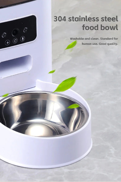 Stainless steel food bowl with white base on a light gray background