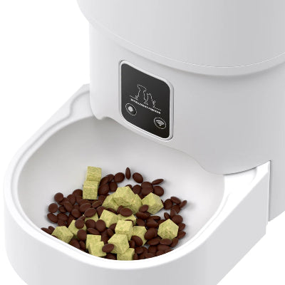 White pet food dispenser with food inside on a white background