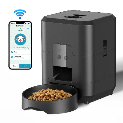 Black pet feeder with bowl of food and smartphone app on a white background