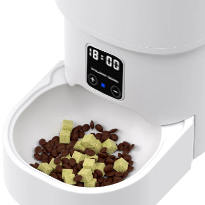 White pet feeder with digital timer displaying '18:00' and food inside.